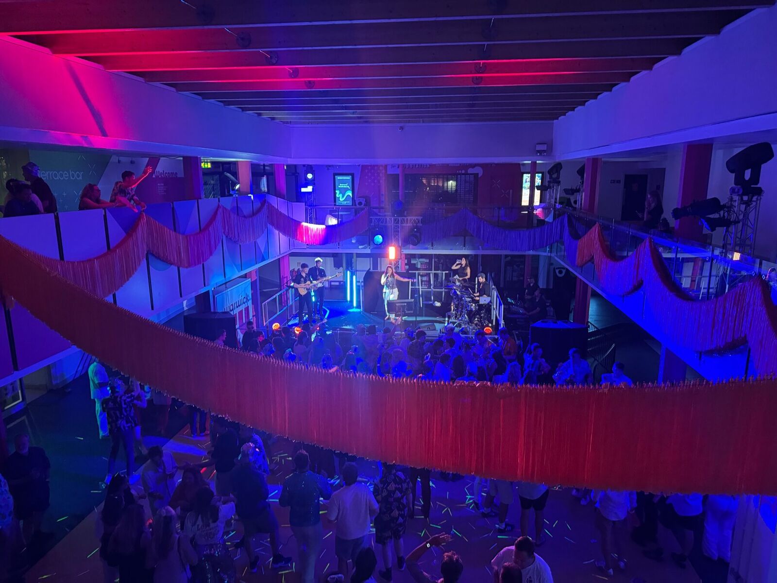 The party band and DJ event underway with lighting and guests