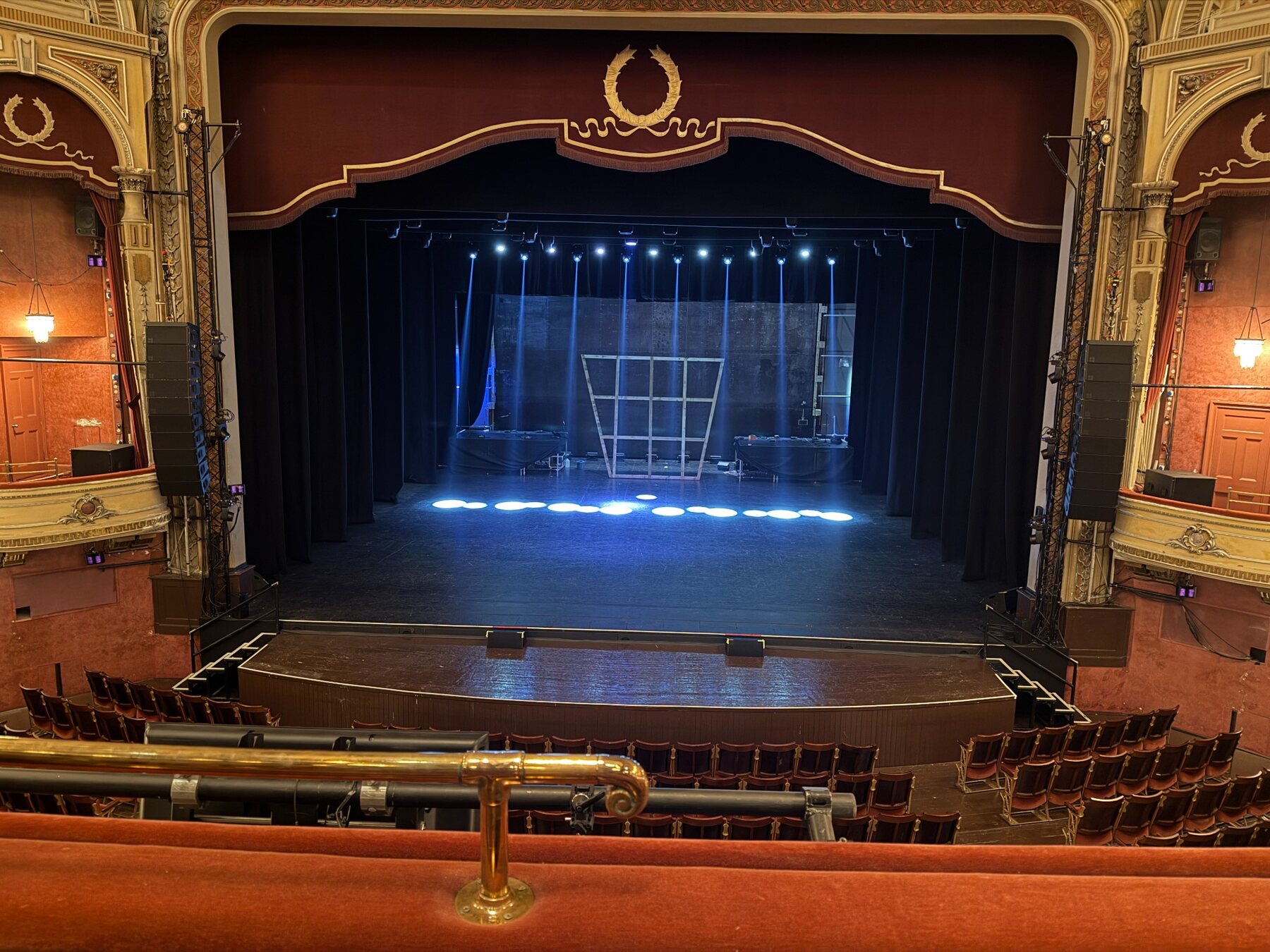 Theatre stage viewed from the auditorium during technical production work